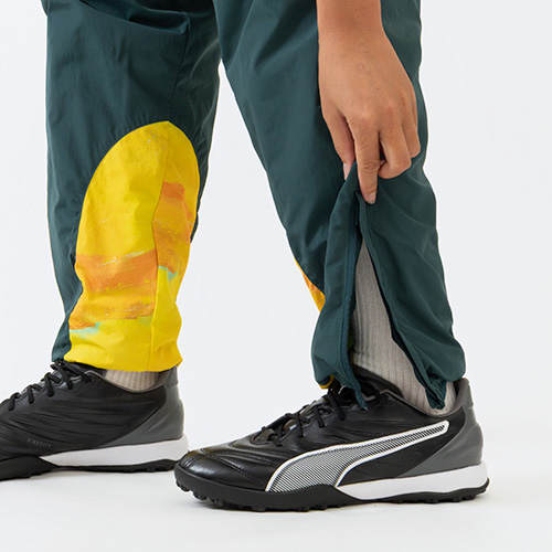 KIDSUPER X マメロディ・サンダウンズFC トラベルパンツ